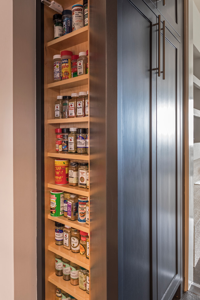 This is an example of a medium sized midcentury kitchen pantry in Denver.