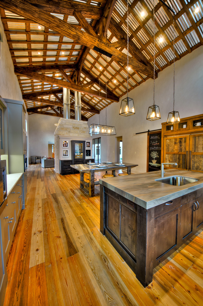 Inspiration for a country eat-in kitchen remodel in Austin with a single-bowl sink and recessed-panel cabinets
