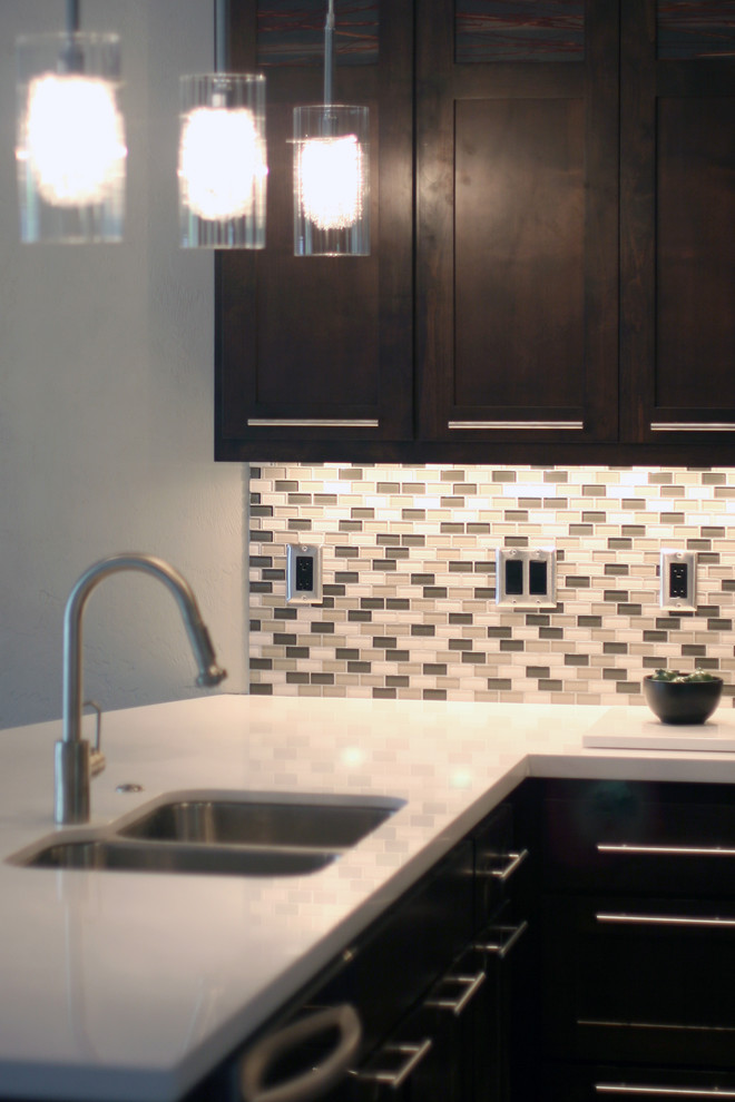 Photo of a medium sized modern u-shaped kitchen/diner in Portland with a submerged sink, shaker cabinets, dark wood cabinets, engineered stone countertops, multi-coloured splashback, mosaic tiled splashback, stainless steel appliances, medium hardwood flooring and a breakfast bar.