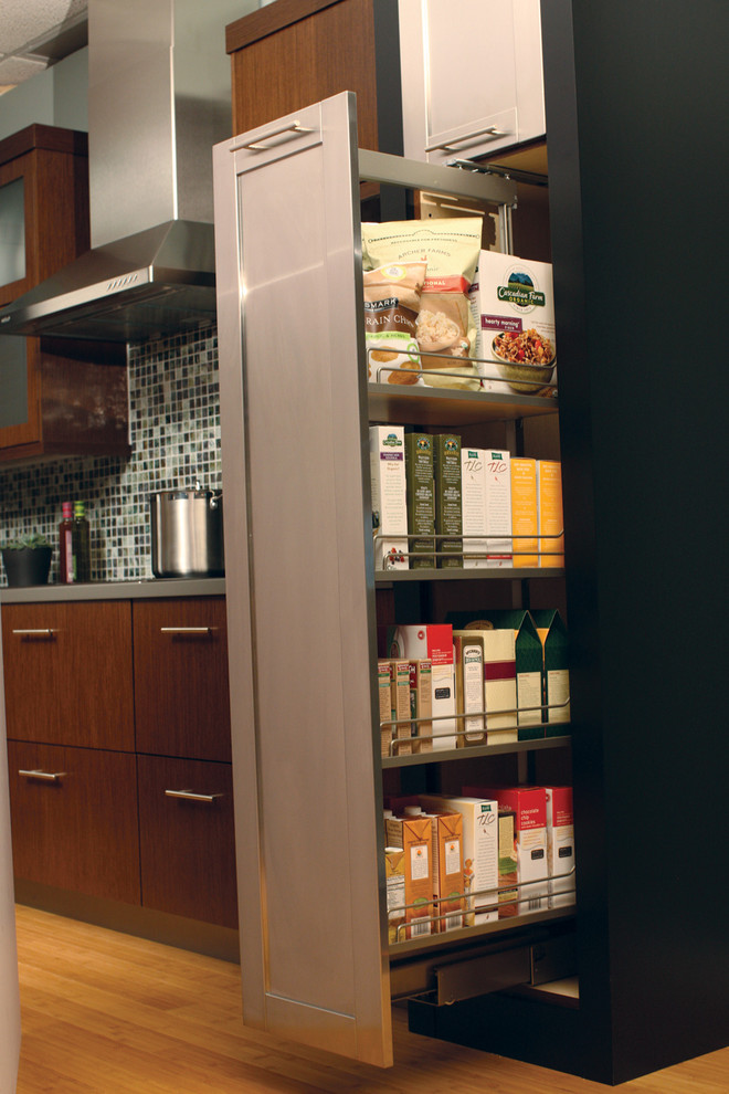 This is an example of a large contemporary l-shaped kitchen/diner in Minneapolis with a submerged sink, flat-panel cabinets, medium wood cabinets, quartz worktops, multi-coloured splashback, mosaic tiled splashback, stainless steel appliances, light hardwood flooring and an island.