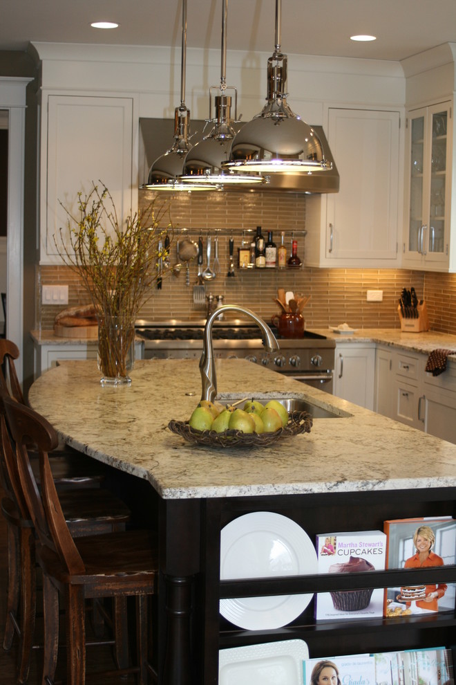 Kitchen pantry - mid-sized traditional u-shaped medium tone wood floor kitchen pantry idea in Chicago with stainless steel appliances, granite countertops, an undermount sink, recessed-panel cabinets, white cabinets, brown backsplash, matchstick tile backsplash and an island