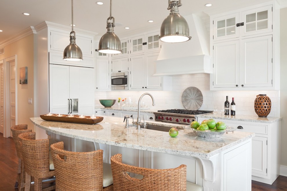 Inspiration for a mid-sized coastal u-shaped dark wood floor eat-in kitchen remodel in New York with an integrated sink, white cabinets, granite countertops, white backsplash, ceramic backsplash, paneled appliances and an island