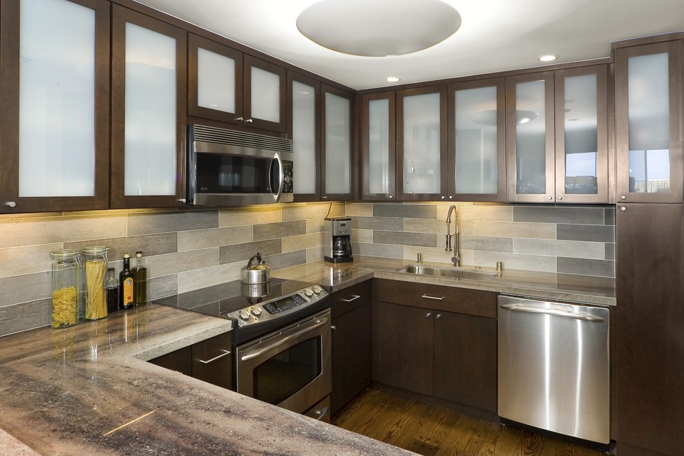 Kitchen - contemporary kitchen idea in San Francisco with glass-front cabinets and stainless steel appliances