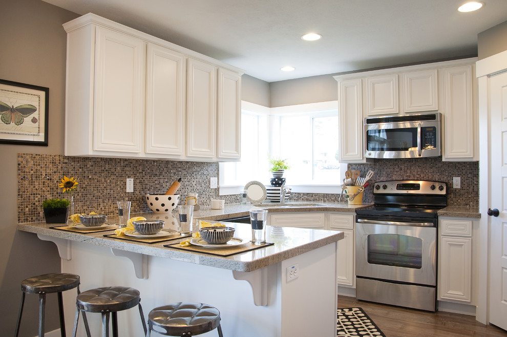 Example of a classic kitchen design in Salt Lake City with stainless steel appliances