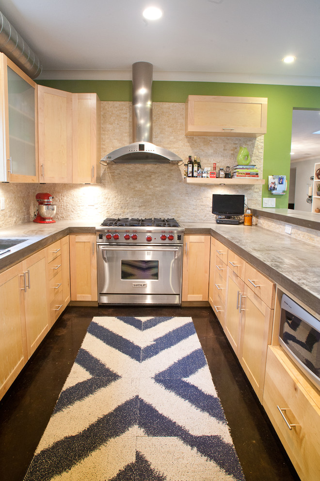 Inspiration for a contemporary kitchen remodel in Dallas with stainless steel appliances, concrete countertops, shaker cabinets, light wood cabinets, beige backsplash and stone tile backsplash