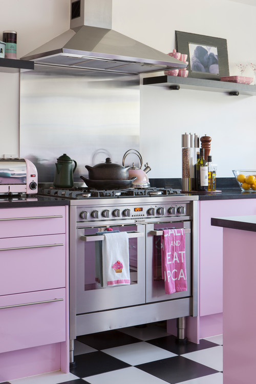 Black Countertops and Floating Shelves in Pastel Pink Cabinets - Charming Retro Kitchen Backsplash Ideas