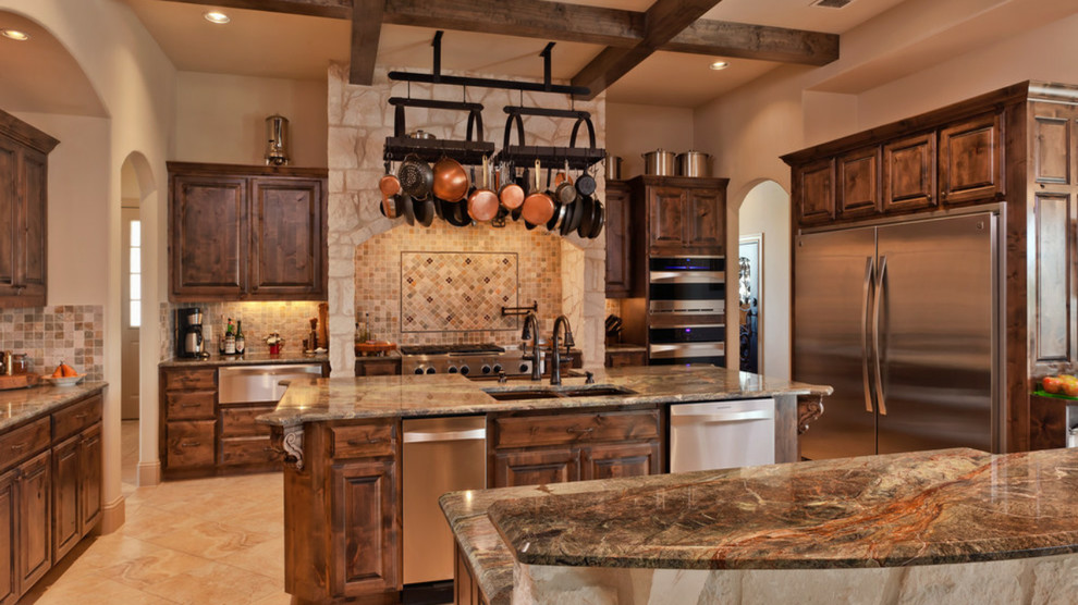 Inspiration for a large rustic u-shaped marble floor and beige floor open concept kitchen remodel in Austin with a double-bowl sink, recessed-panel cabinets, medium tone wood cabinets, marble countertops, beige backsplash, mosaic tile backsplash, two islands and stainless steel appliances