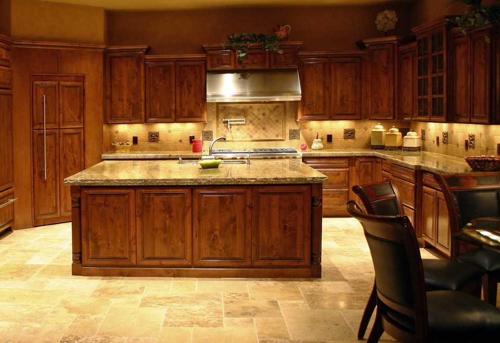 Photo of an eclectic kitchen in Phoenix with brown splashback, stone tiled splashback and limestone flooring.