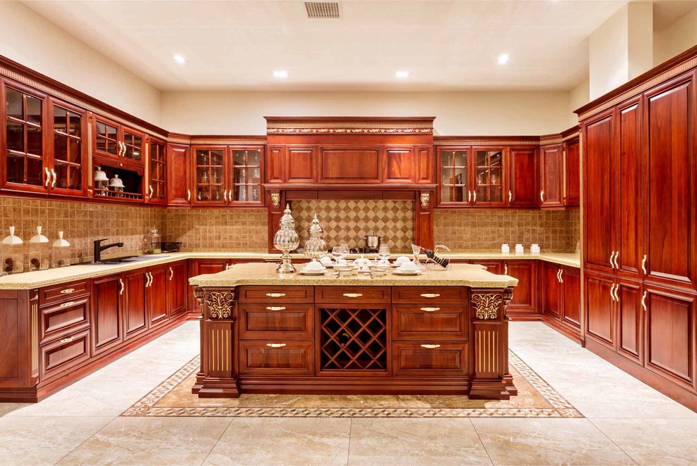Photo of a large traditional u-shaped enclosed kitchen in Orange County with beaded cabinets, medium wood cabinets, granite worktops, beige splashback, ceramic splashback, an island, a double-bowl sink, integrated appliances and ceramic flooring.