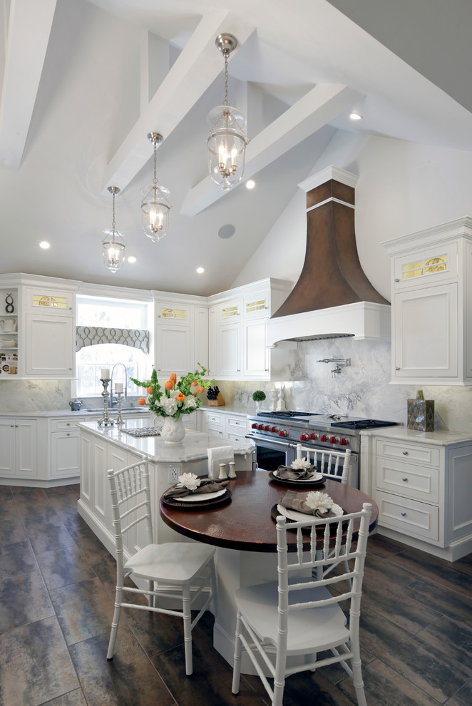 Inspiration for a large rural l-shaped kitchen/diner in New York with recessed-panel cabinets, white cabinets, white splashback, stainless steel appliances, an island, a submerged sink and porcelain flooring.