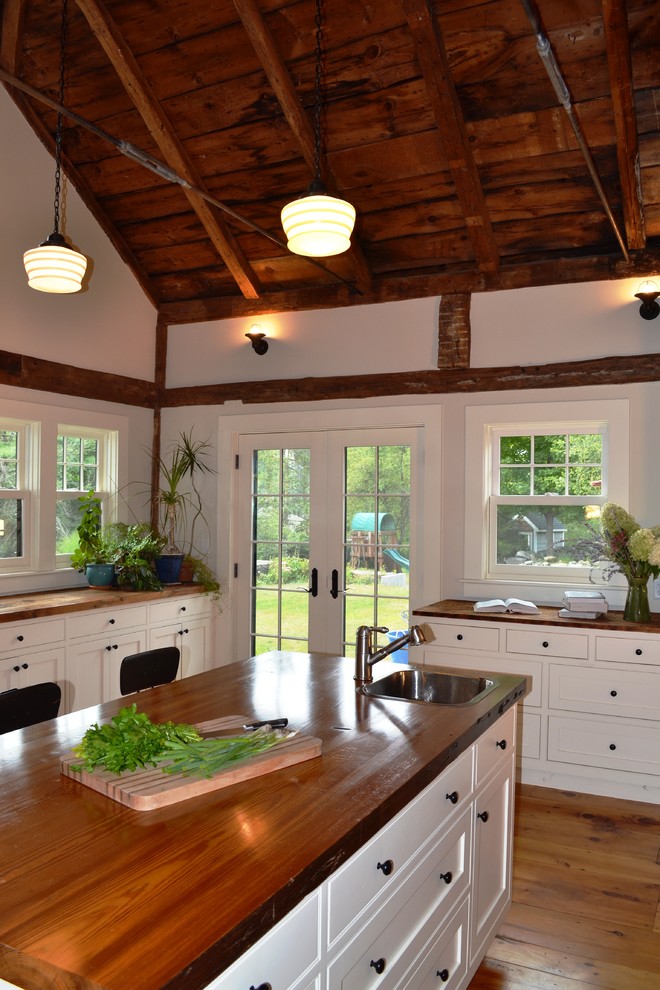 This is an example of a rustic kitchen in Boston.
