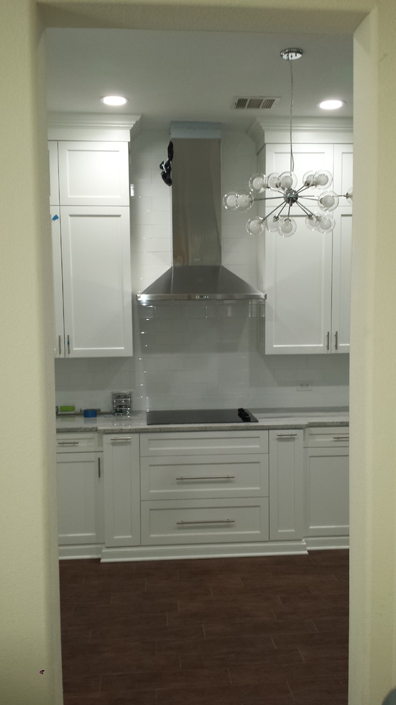 Vent Hood and Spice racks left and right of cooktop Modern Kitchen