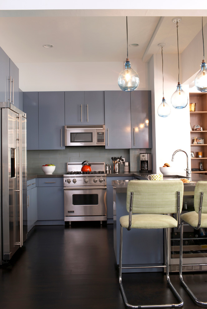Photo of a contemporary kitchen in New York with stainless steel appliances.