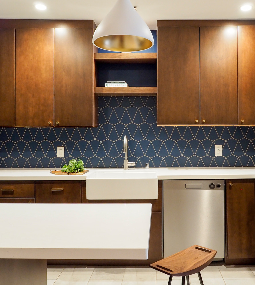 サンフランシスコにあるお手頃価格の小さなコンテンポラリースタイルのおしゃれなキッチン (エプロンフロントシンク、フラットパネル扉のキャビネット、濃色木目調キャビネット、青いキッチンパネル、セラミックタイルのキッチンパネル、シルバーの調理設備、セラミックタイルの床、ベージュの床、白いキッチンカウンター) の写真