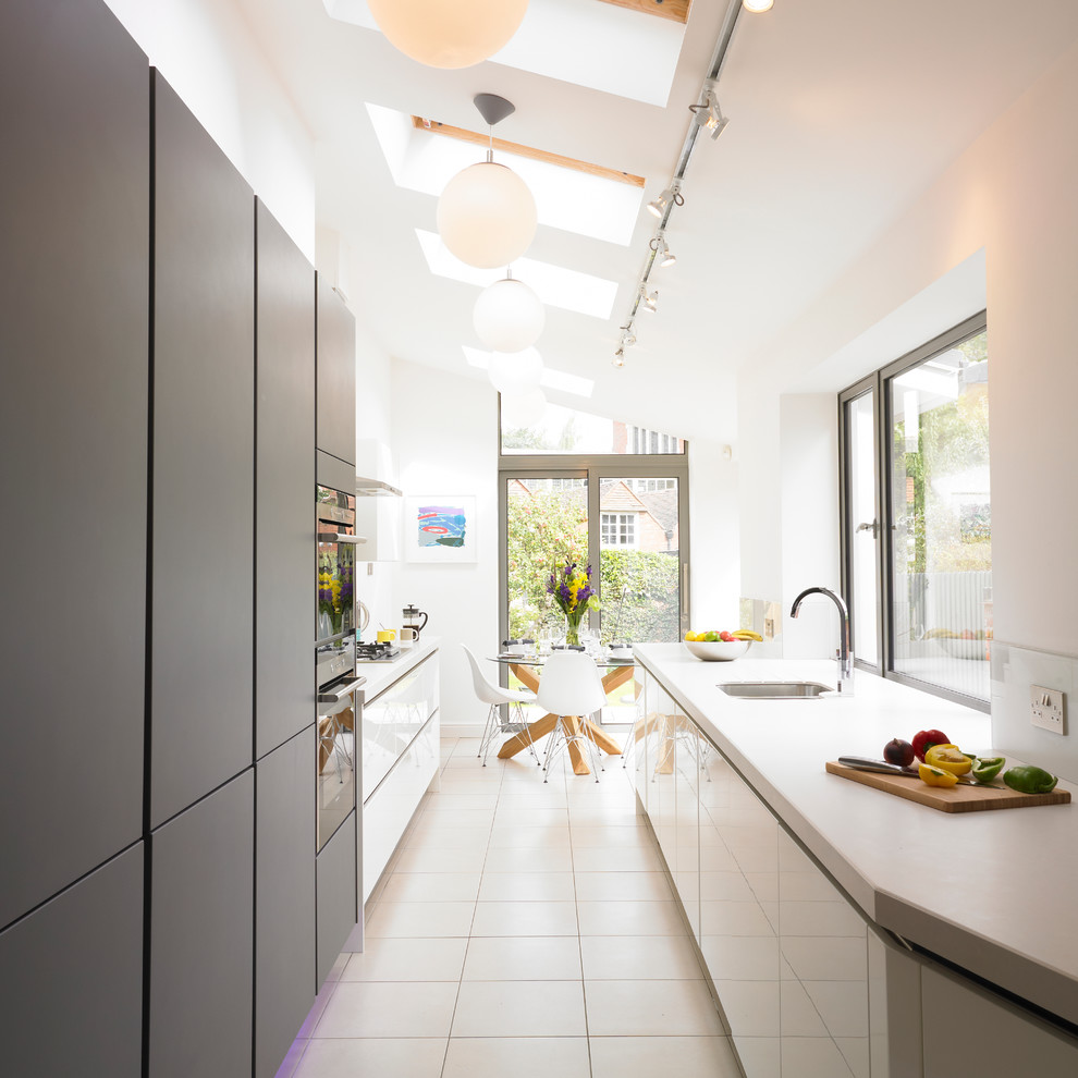 Inspiration for a contemporary grey and cream kitchen in West Midlands.