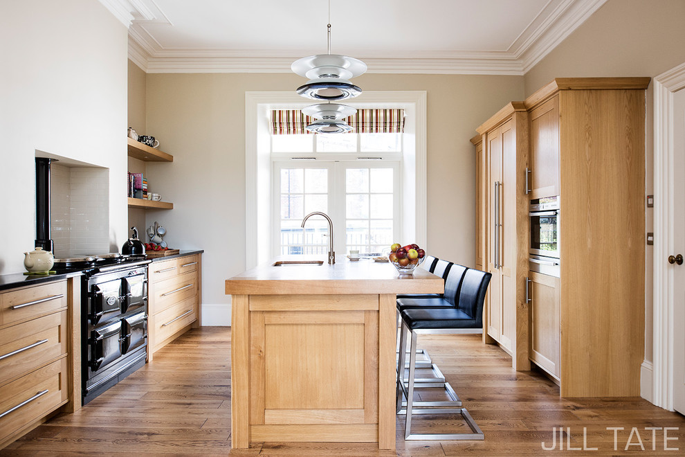 Inspiration for a victorian kitchen/diner in Other with shaker cabinets, medium wood cabinets, granite worktops, medium hardwood flooring and an island.