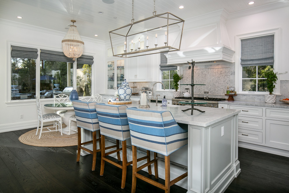 Kitchen - transitional dark wood floor, brown floor and shiplap ceiling kitchen idea in Los Angeles with a farmhouse sink, shaker cabinets, white cabinets, marble countertops, multicolored backsplash, marble backsplash, stainless steel appliances, an island and gray countertops