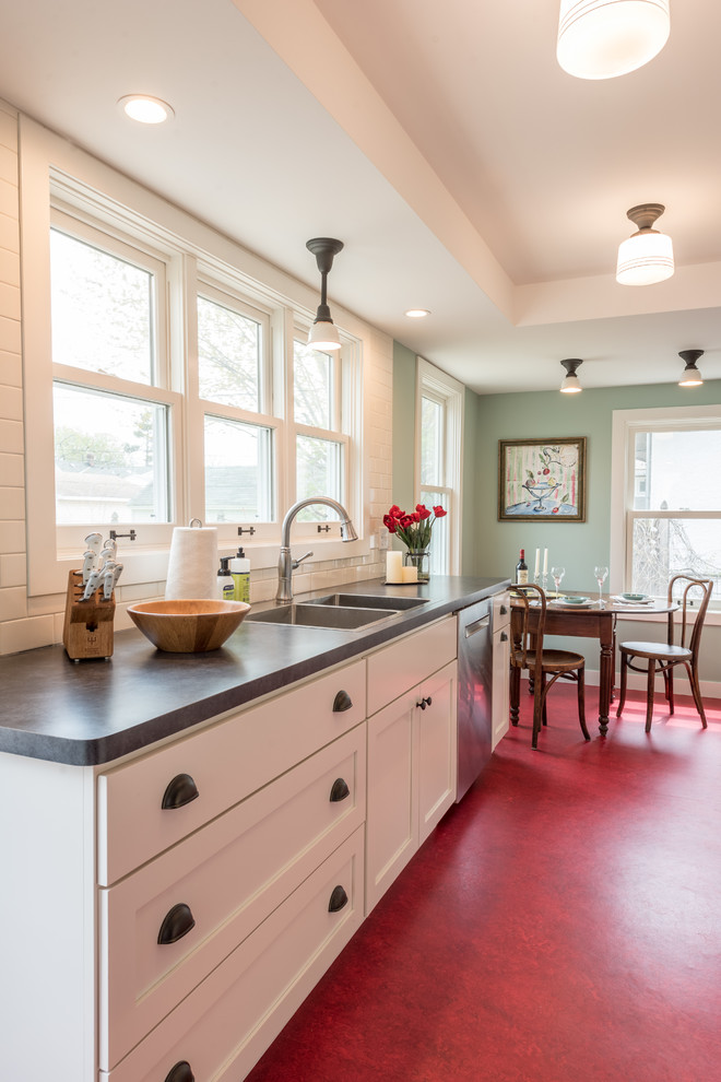 Example of a farmhouse red floor kitchen design in Minneapolis