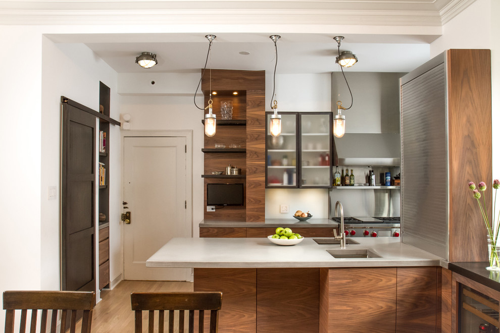 Traditional galley kitchen/diner in Chicago with a submerged sink, open cabinets, dark wood cabinets, concrete worktops, metallic splashback and stainless steel appliances.