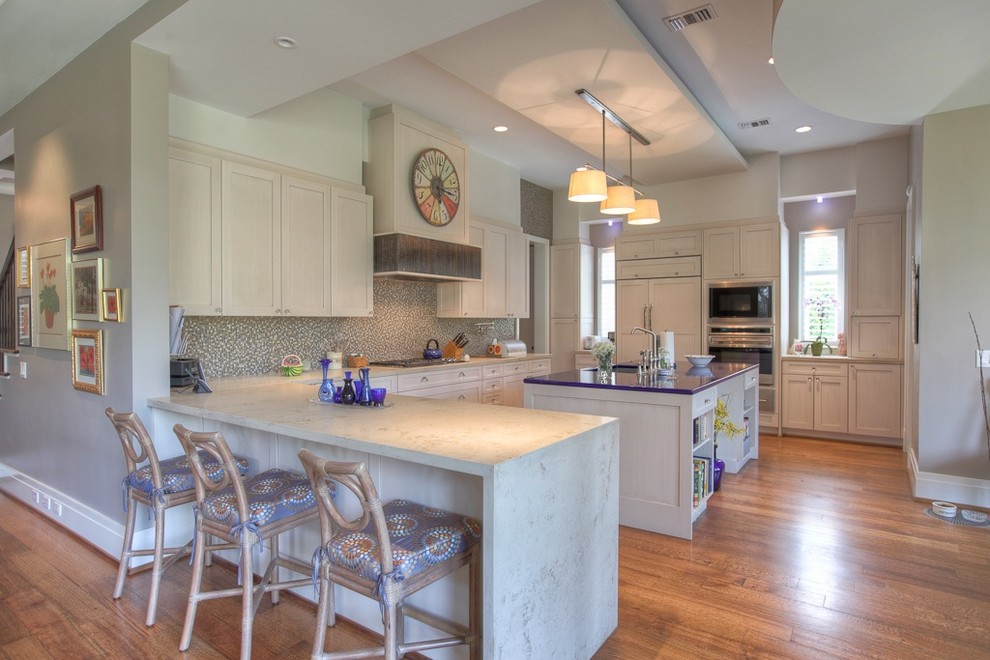 Eat-in kitchen - large modern u-shaped medium tone wood floor and brown floor eat-in kitchen idea in Houston with a double-bowl sink, shaker cabinets, quartz countertops, multicolored backsplash, paneled appliances, white cabinets, an island and purple countertops