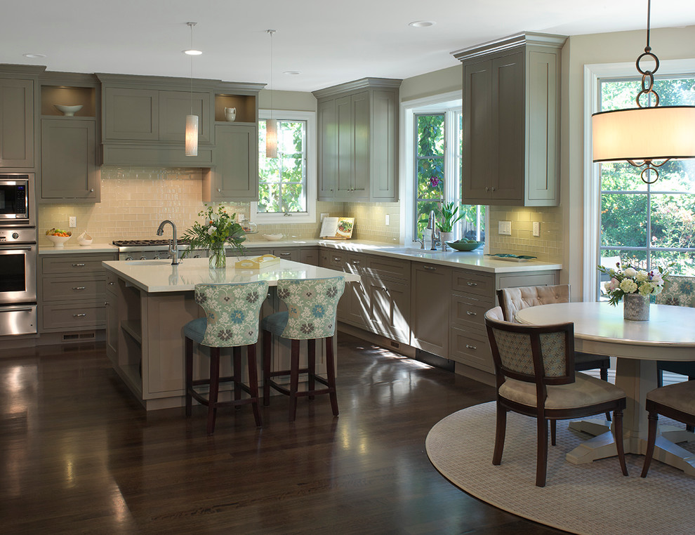 Kitchen - contemporary l-shaped kitchen idea with green cabinets, recessed-panel cabinets, quartz countertops, beige backsplash and glass tile backsplash