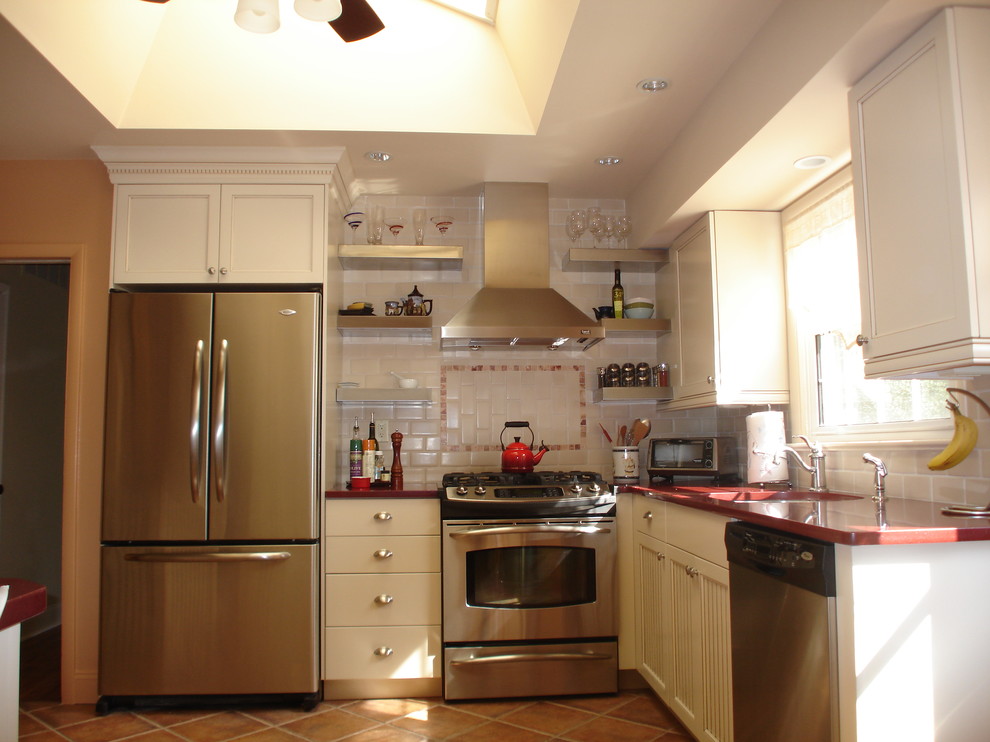 Inspiration for an eclectic kitchen in Philadelphia with stainless steel appliances and red worktops.
