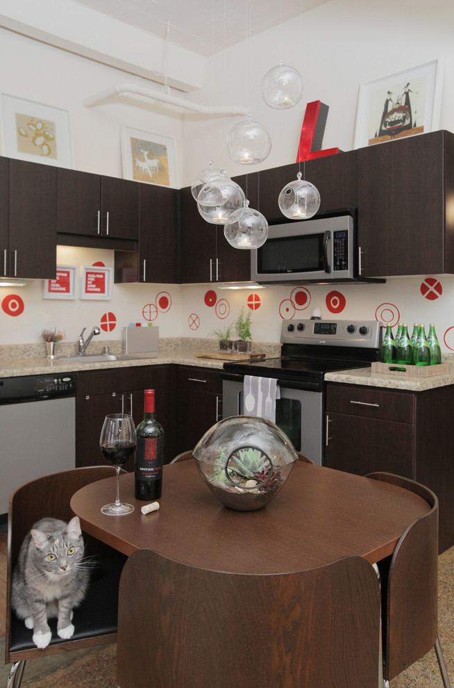 Example of an eclectic l-shaped eat-in kitchen design in Dallas with flat-panel cabinets, dark wood cabinets and multicolored backsplash