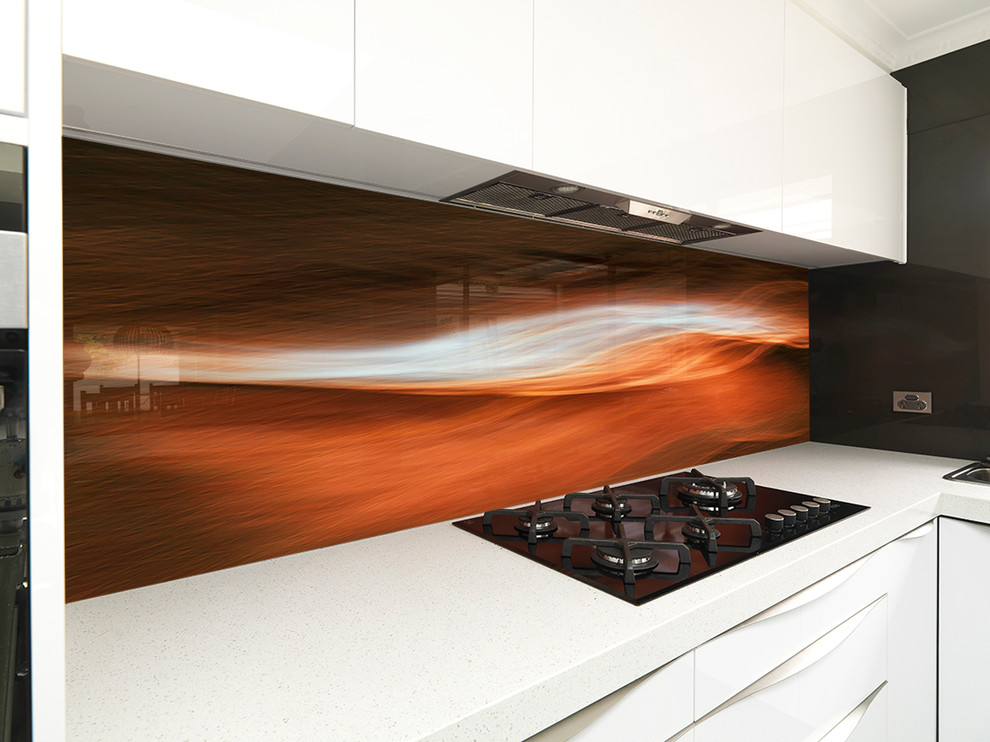 Example of a huge trendy eat-in kitchen design in Melbourne with quartz countertops and glass sheet backsplash