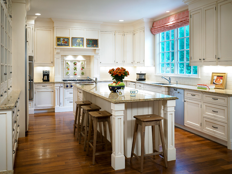 Eat-in kitchen - traditional u-shaped dark wood floor eat-in kitchen idea in Chicago with beaded inset cabinets, white cabinets, granite countertops and an island