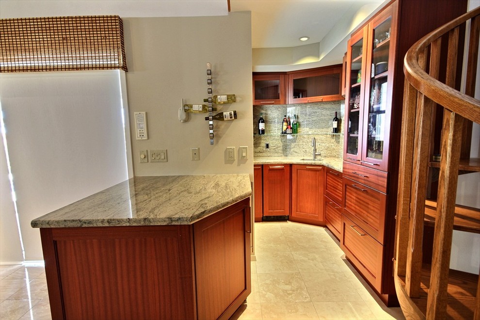 Inspiration for a small tropical l-shaped travertine floor kitchen remodel in Hawaii with a single-bowl sink, recessed-panel cabinets, medium tone wood cabinets, granite countertops and a peninsula