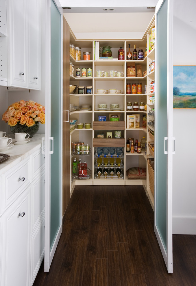 Example of a large classic dark wood floor kitchen pantry design in New York with white cabinets, open cabinets, marble countertops, white backsplash and no island