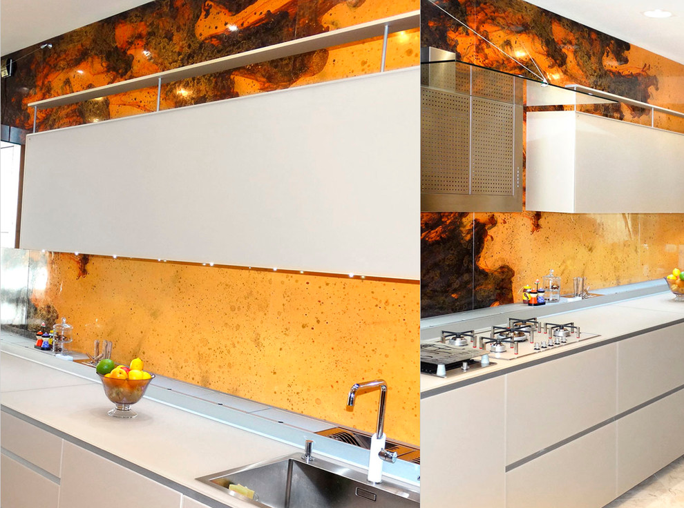Kitchen - modern kitchen idea in Miami with orange backsplash