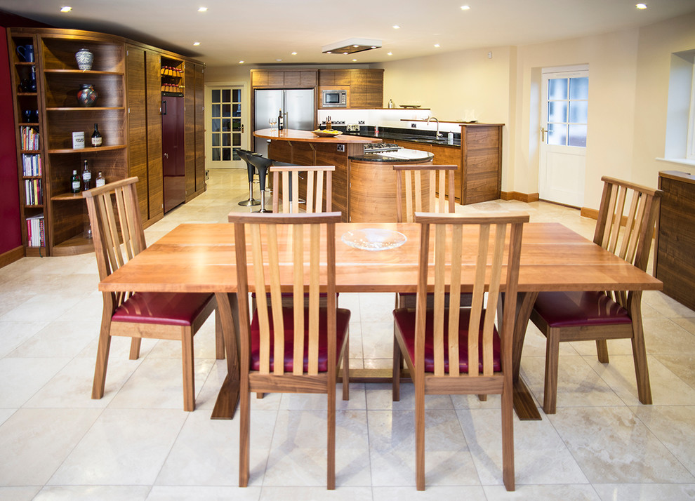 Photo of a medium sized contemporary kitchen/diner in Dorset with an integrated sink, granite worktops and an island.