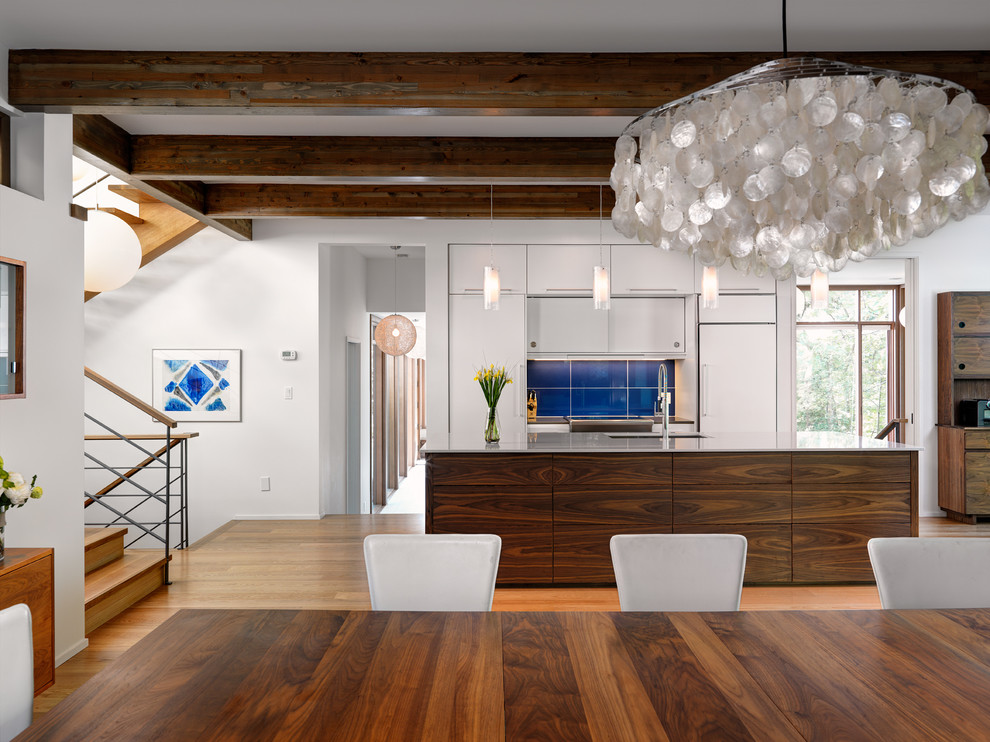 Open concept kitchen - contemporary galley open concept kitchen idea in Vancouver with flat-panel cabinets and white cabinets