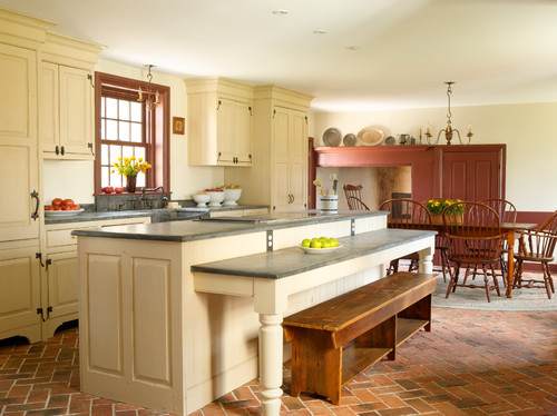 Warm cream RTA Cabinet Colors combined with natural light and rustic accents to create a welcoming kitchen atmosphere
