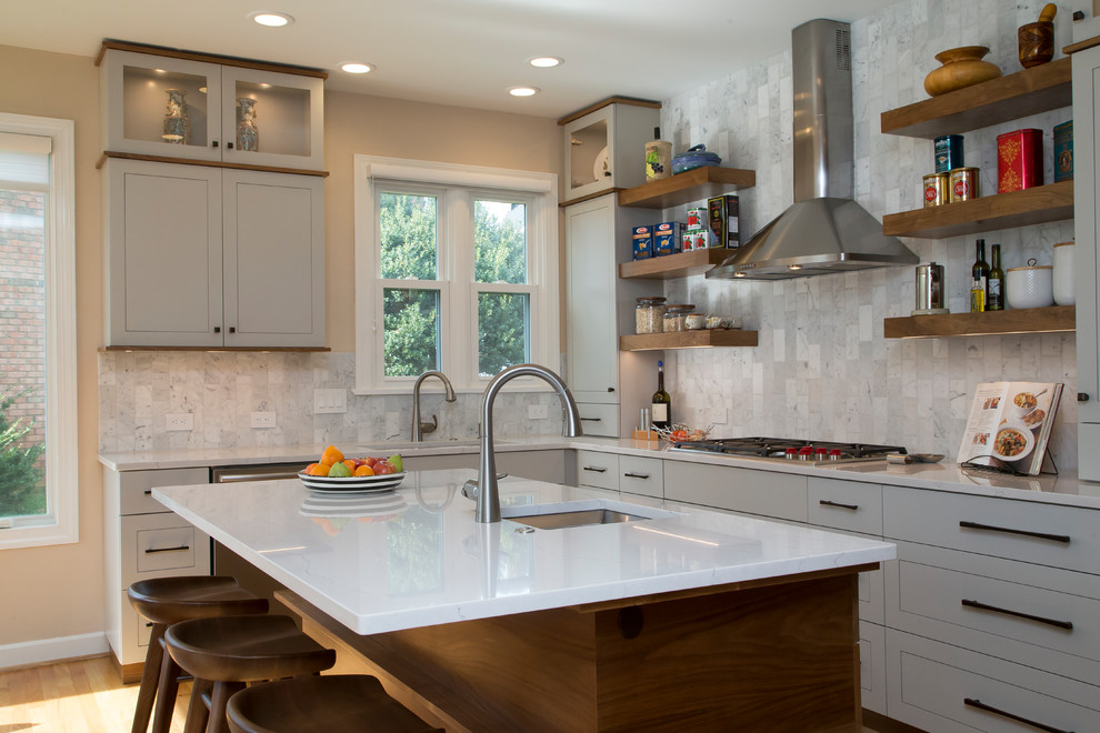 Inspiration for a large contemporary l-shaped medium tone wood floor and orange floor eat-in kitchen remodel in Raleigh with a single-bowl sink, shaker cabinets, gray cabinets, quartz countertops, gray backsplash, marble backsplash, stainless steel appliances, an island and white countertops