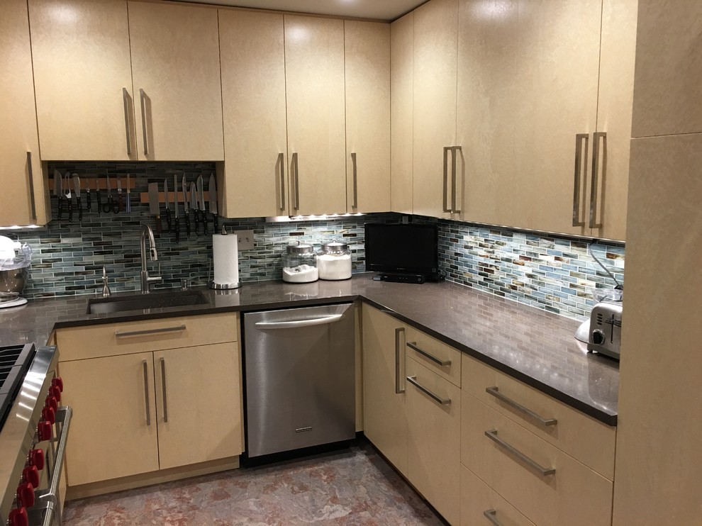 Small trendy u-shaped cork floor enclosed kitchen photo in DC Metro with an undermount sink, flat-panel cabinets, yellow cabinets, recycled glass countertops, glass tile backsplash, stainless steel appliances and no island