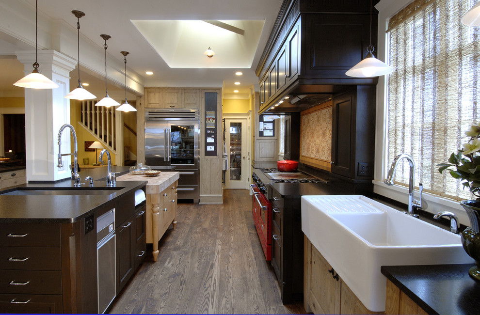 Example of a classic kitchen design in Seattle with a single-bowl sink, recessed-panel cabinets, black cabinets, multicolored backsplash and colored appliances