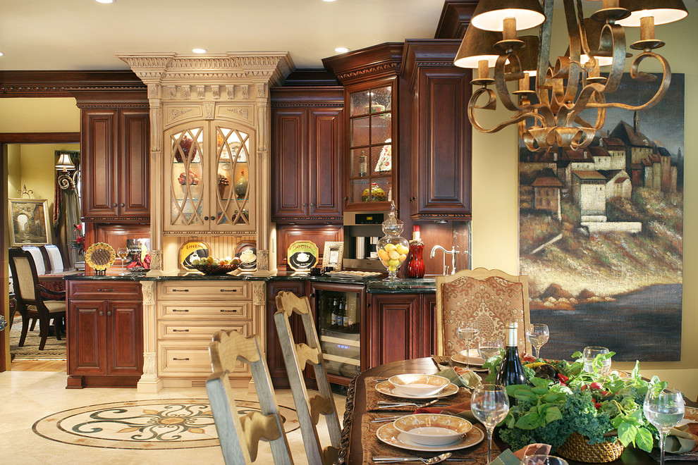 Example of a huge tuscan l-shaped travertine floor kitchen pantry design in New York with an undermount sink, raised-panel cabinets, dark wood cabinets, stone slab backsplash and an island