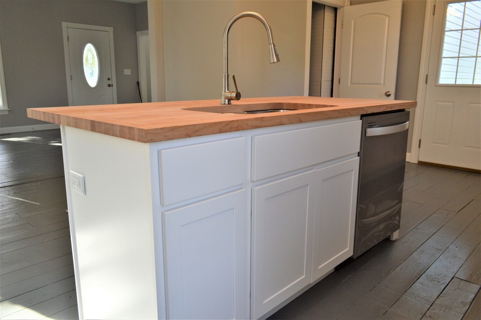 Photo of a large modern single-wall kitchen/diner in Other with a submerged sink, shaker cabinets, white cabinets, wood worktops, painted wood flooring, an island, grey floors and brown worktops.
