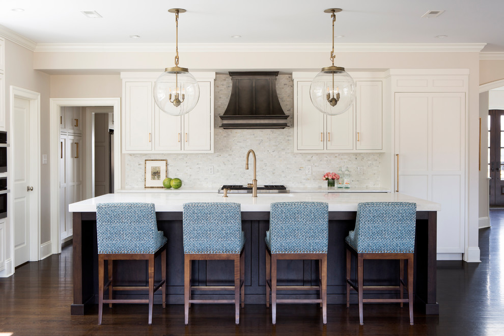 Mid-sized transitional dark wood floor and brown floor open concept kitchen photo in Philadelphia with white cabinets, quartzite countertops, white backsplash, marble backsplash, an island, white countertops and shaker cabinets