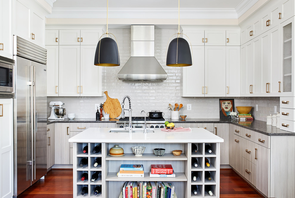 Kitchen - mid-sized transitional u-shaped medium tone wood floor and brown floor kitchen idea in DC Metro with subway tile backsplash, stainless steel appliances, an island, an undermount sink, shaker cabinets, white cabinets, green backsplash and white countertops
