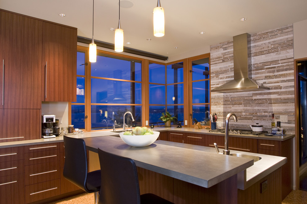 Trendy l-shaped cork floor enclosed kitchen photo in Seattle with an undermount sink, flat-panel cabinets, dark wood cabinets, concrete countertops, gray backsplash, stone tile backsplash, stainless steel appliances and an island
