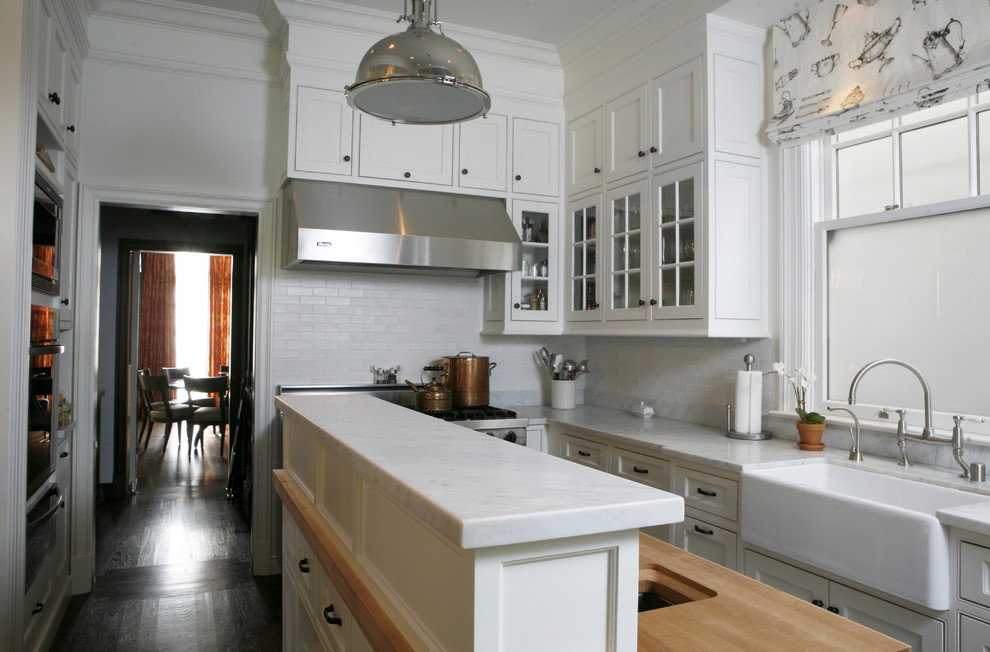 This is an example of a classic kitchen in San Francisco with a belfast sink and stainless steel appliances.