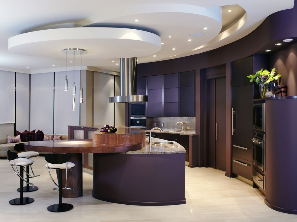 Example of a large trendy galley limestone floor open concept kitchen design in Toronto with granite countertops, an undermount sink, flat-panel cabinets, metallic backsplash, metal backsplash, stainless steel appliances and an island