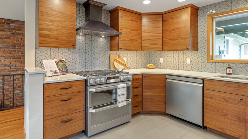 Inspiration for a large 1960s porcelain tile and beige floor eat-in kitchen remodel in Other with an undermount sink, flat-panel cabinets, medium tone wood cabinets, gray backsplash, stainless steel appliances, no island and white countertops