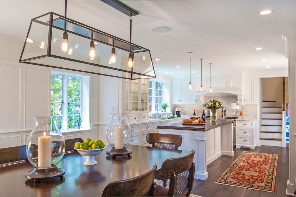 Inspiration for a large timeless l-shaped dark wood floor eat-in kitchen remodel in Philadelphia with an undermount sink, flat-panel cabinets, white cabinets, wood countertops, white backsplash, stone tile backsplash, stainless steel appliances and an island