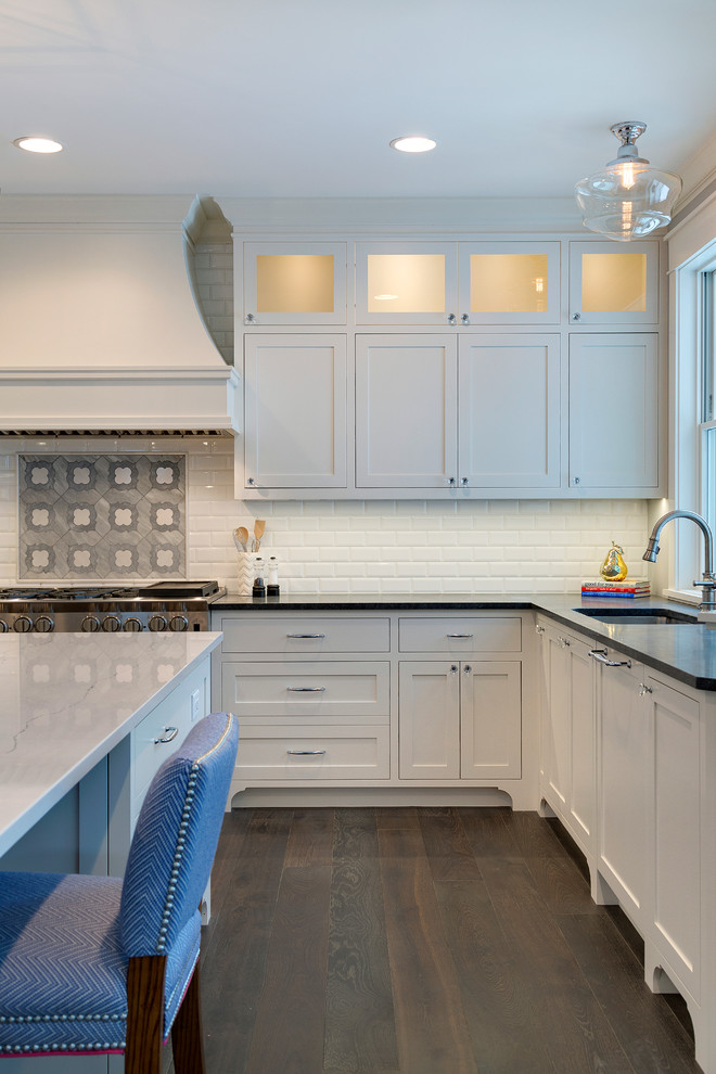 Example of a large classic u-shaped dark wood floor open concept kitchen design in Minneapolis with an undermount sink, shaker cabinets, white cabinets, marble countertops, white backsplash, subway tile backsplash, paneled appliances and an island