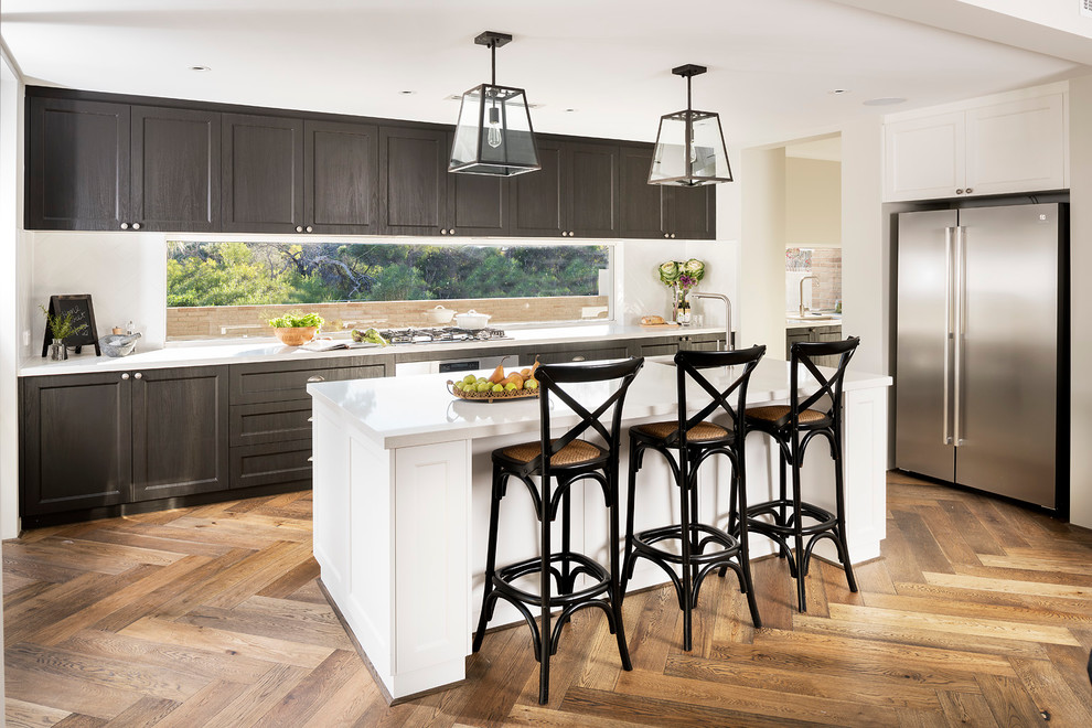 Inspiration for a transitional medium tone wood floor kitchen remodel in Perth with white backsplash, shaker cabinets, dark wood cabinets, matchstick tile backsplash, stainless steel appliances and an island