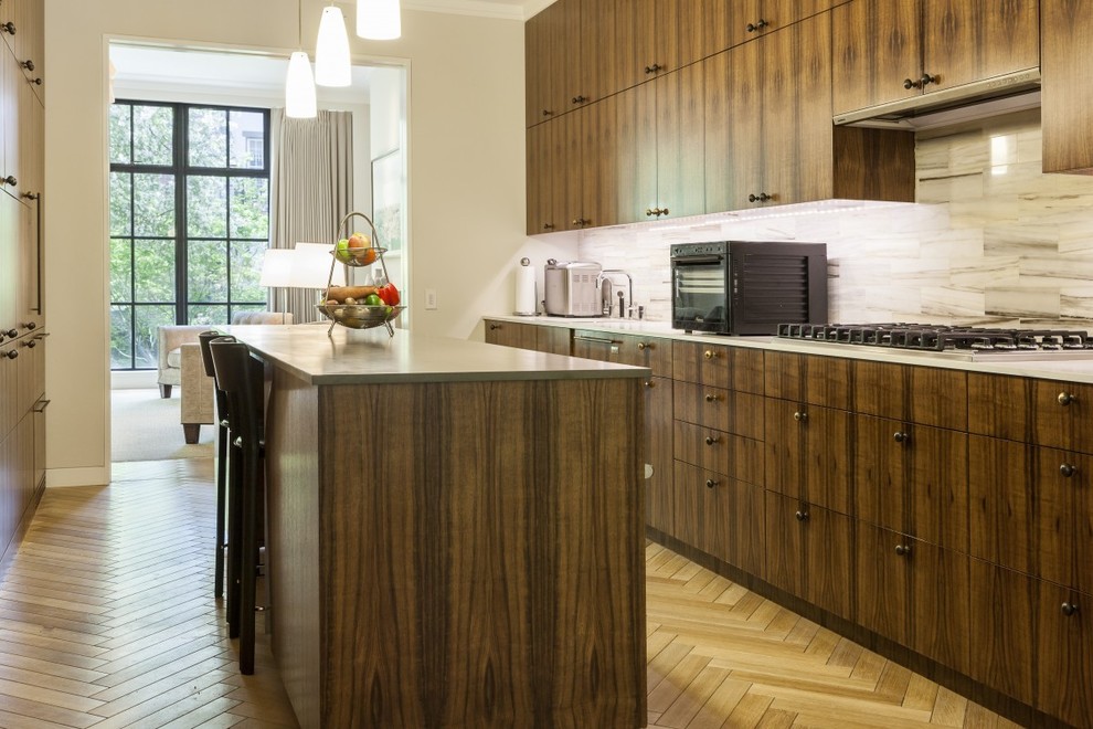 Contemporary kitchen in New York with light hardwood flooring.